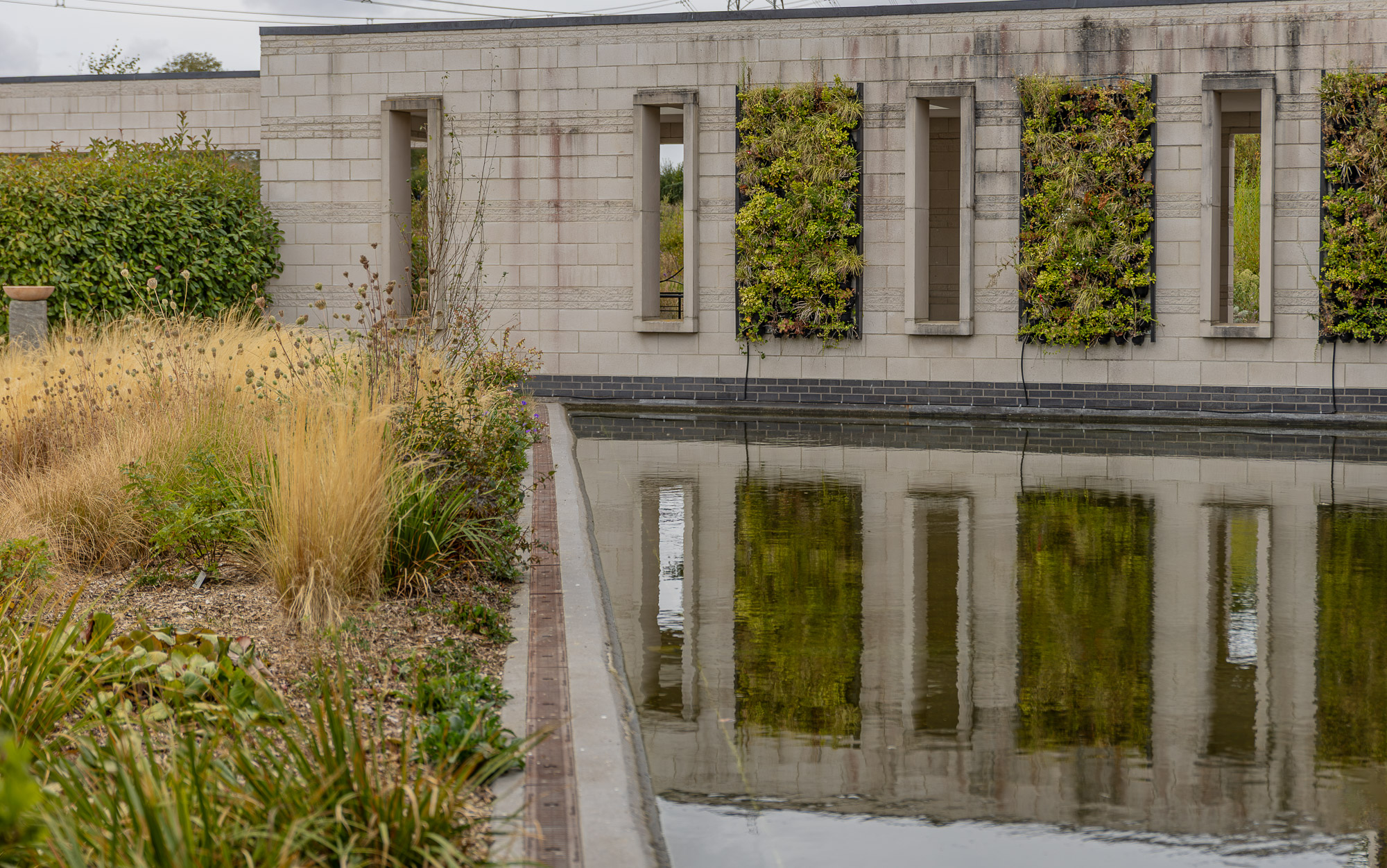The peaceful memorial garden and reflection pool at Wealden Crematorium