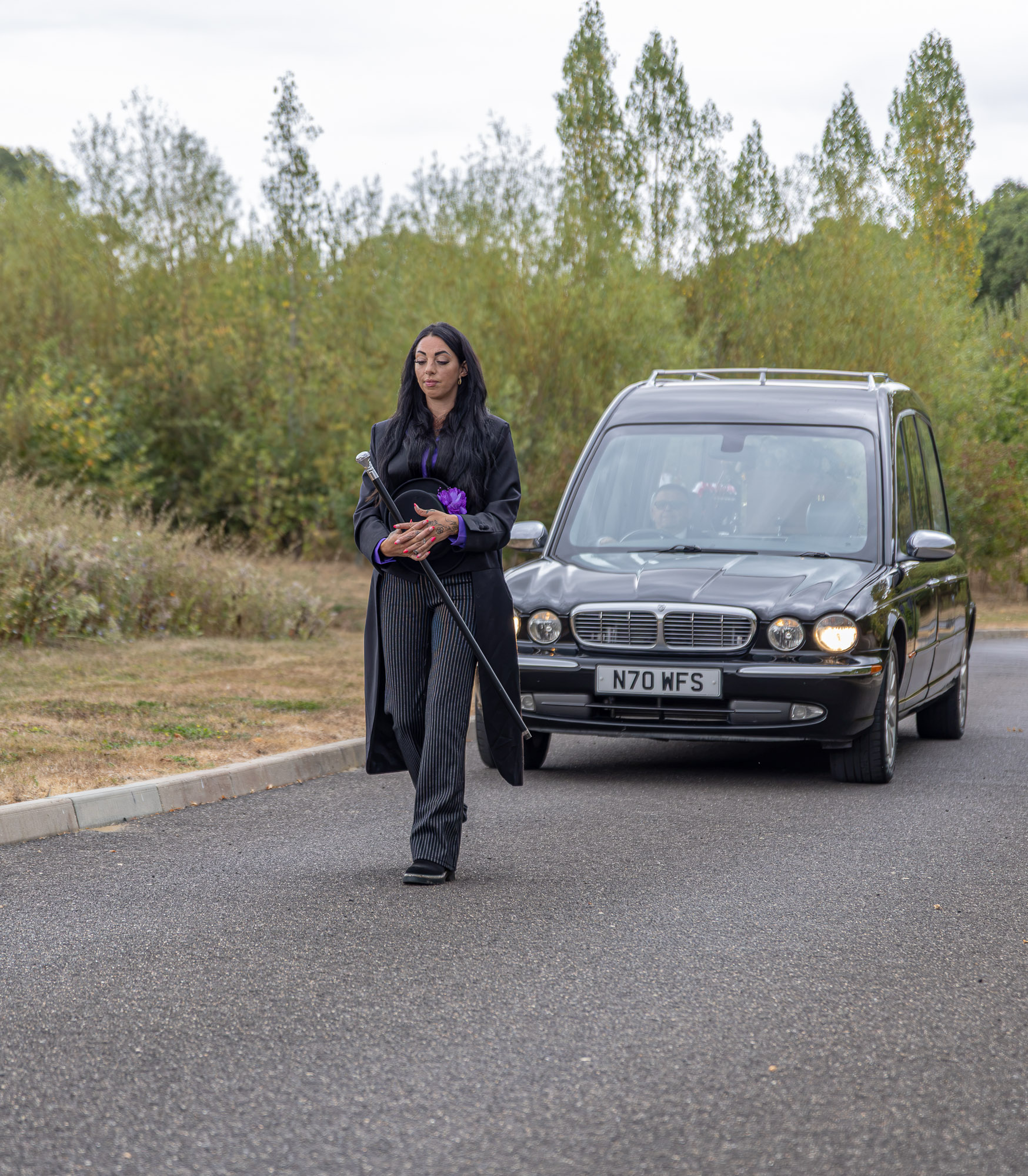 Stacie beside the Wealden hearse