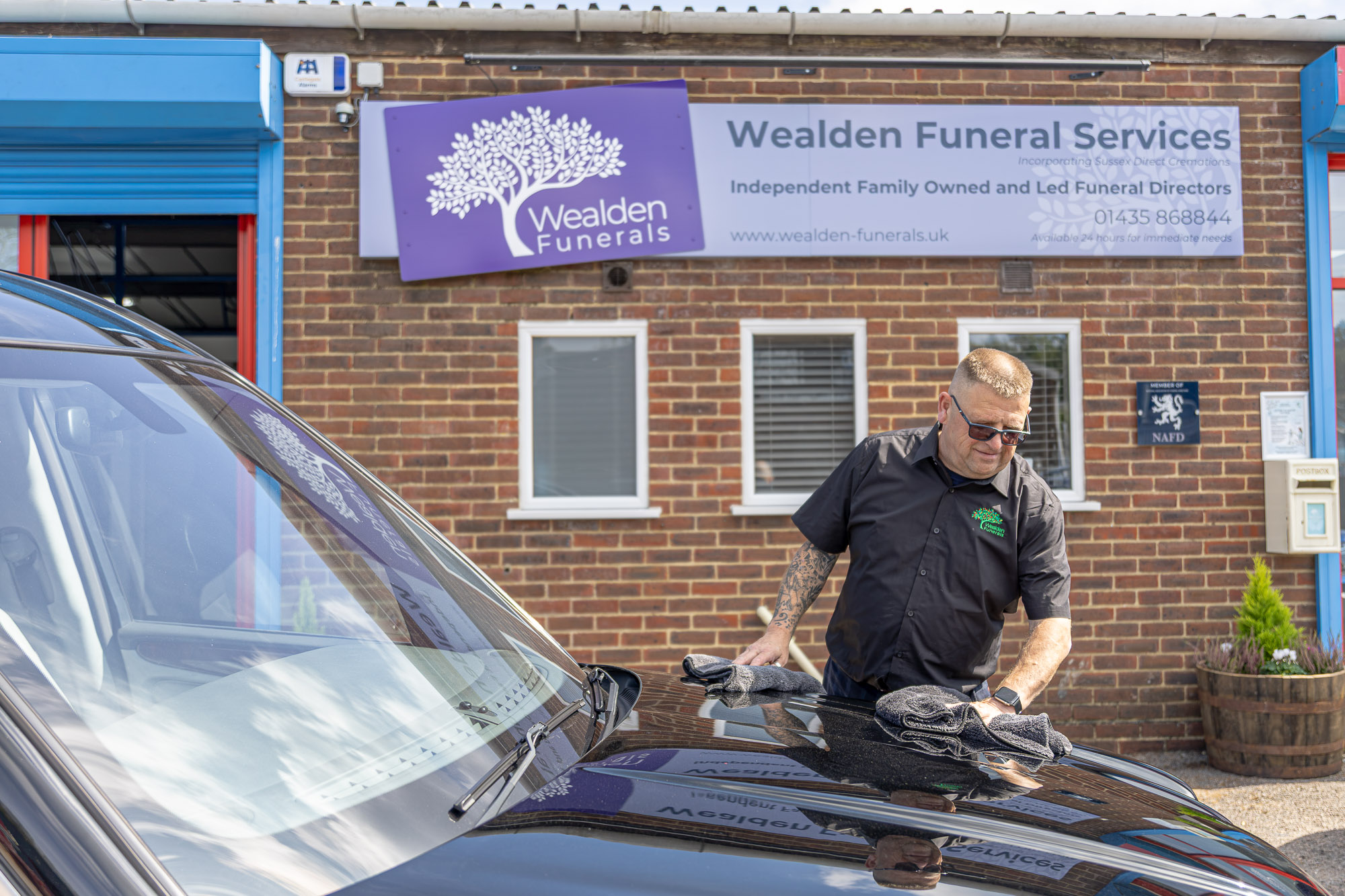 Andy preparing the hearse outside Wealden Funeral Services in Heathfield
