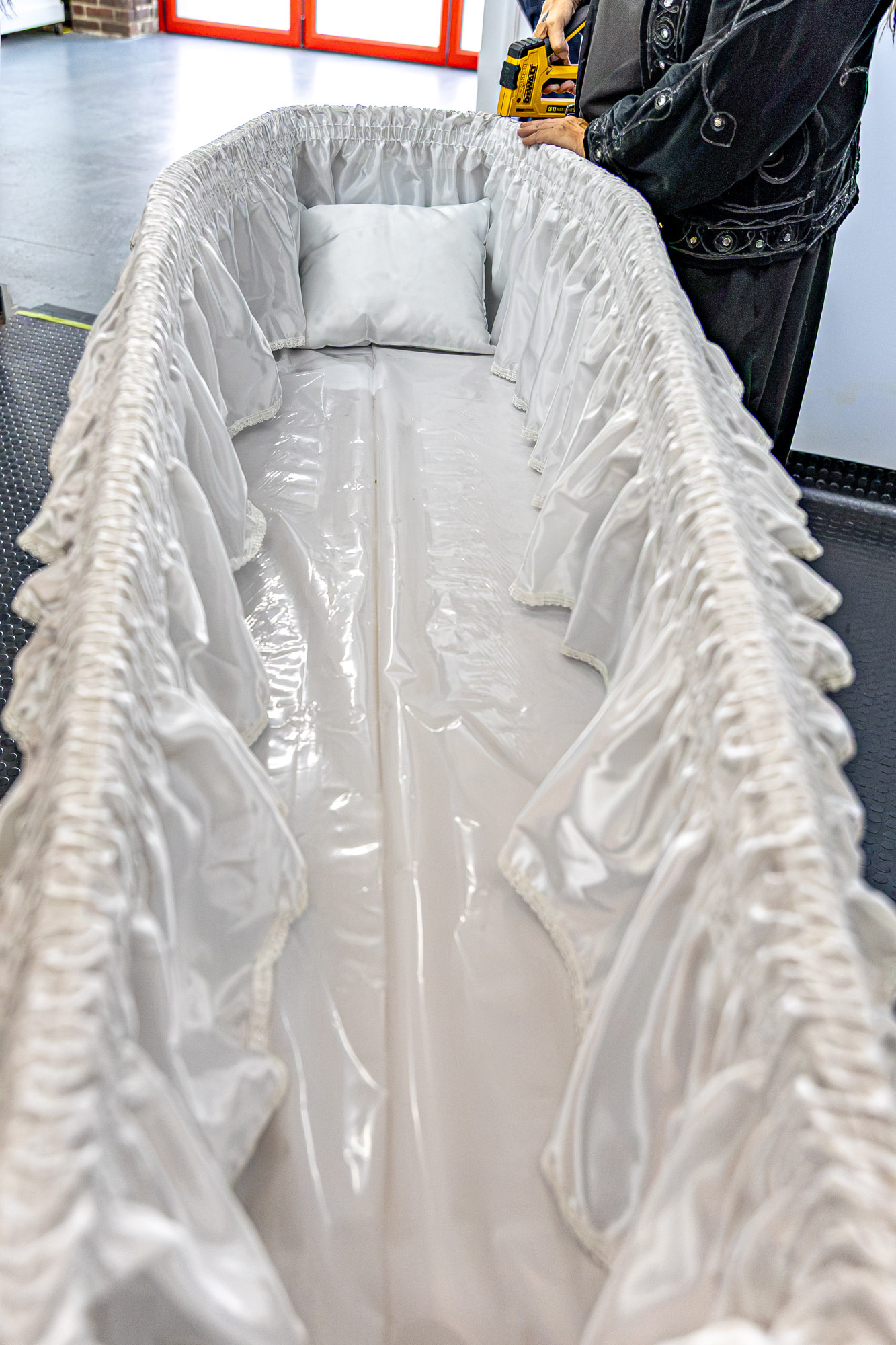 The carefully prepared interior of a simple wooden coffin